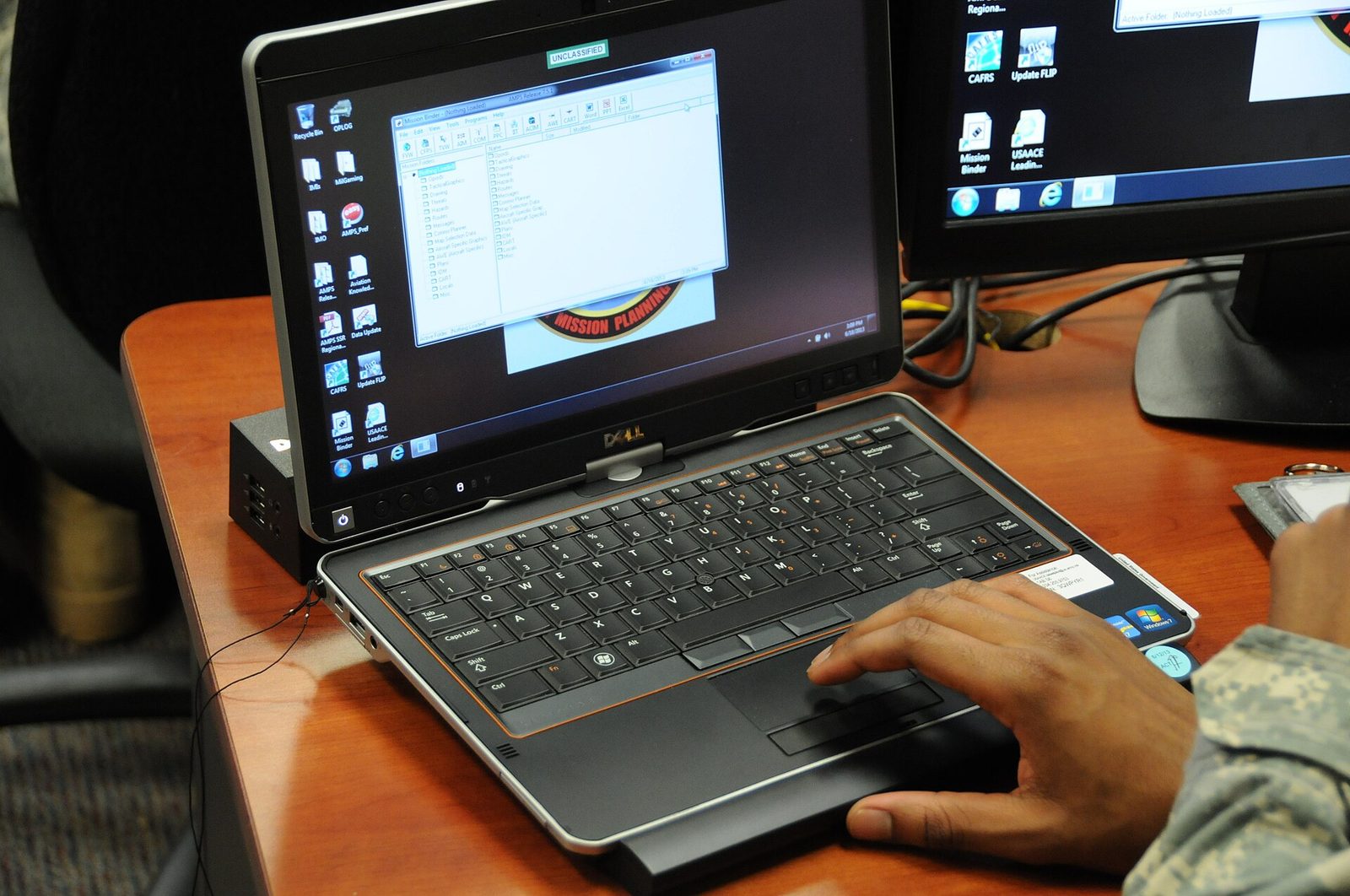Students working together on laptops during a class.